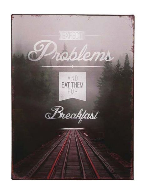 Tekstbord: "Expect problems and eat them for breakfast"